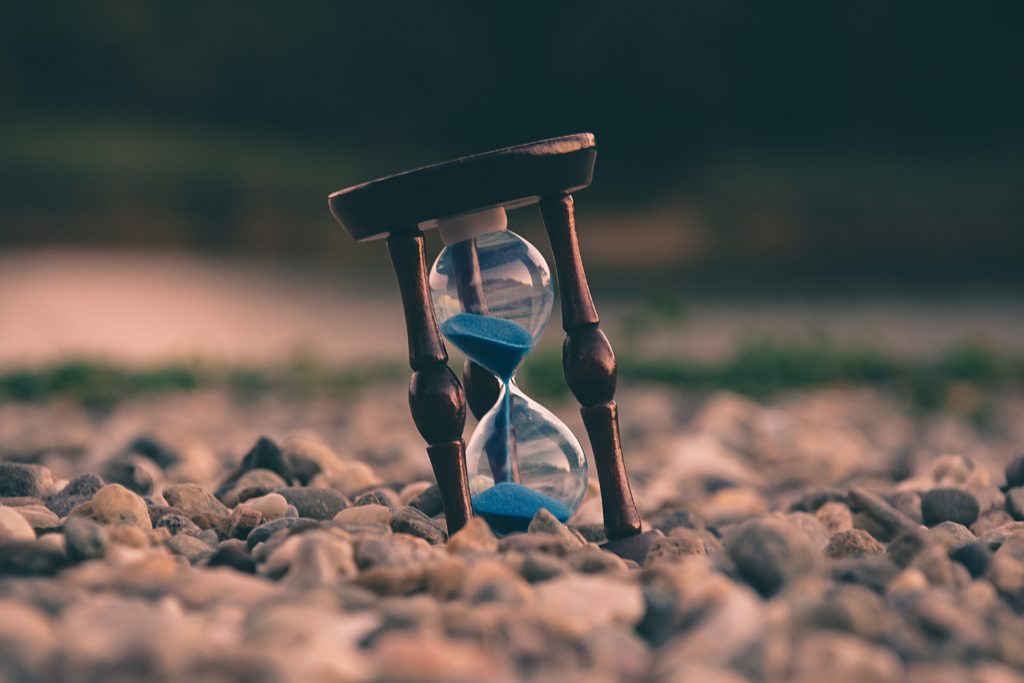A picture of an hourglass to represent the concept of finding time.